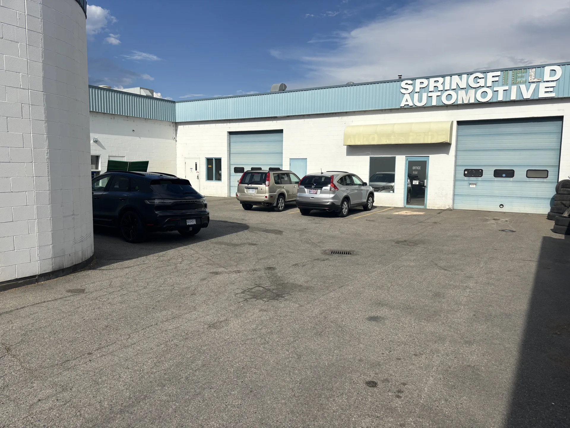 1987 Kirschner Road, Kelowna — rear automotive shop with grade-level overhead doors